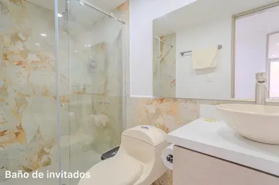 a bathroom with a shower and a toilet and a sink at lujoso apartamento familiar frente al mar in Cartagena de Indias