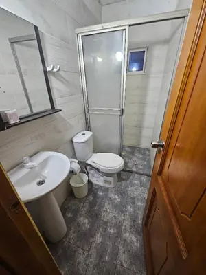 a bathroom with a white sink and a toilet at Cabaña Sol y Mar 2 in Coveñas