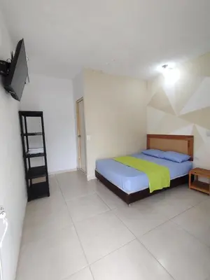 a bedroom with a bed and a ladder in it at casa Marez in Cartagena de Indias