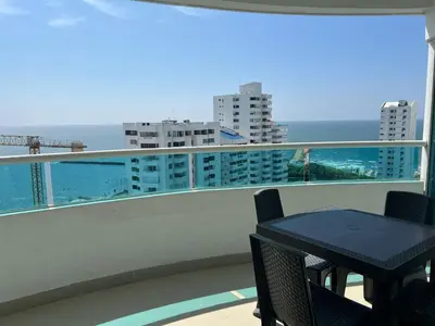 a balcony with a table and a view of the ocean at Apartamento con vista al mar in Cartagena de Indias