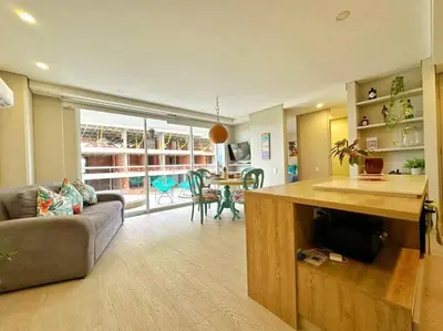 a living room with a couch and a table in it at Cartagena Martinique - Hermoso apartamento con Jacuzzi en el Balcón! in Cartagena de Indias