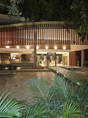 a large building with a courtyard at night at Cartagena Martinique - Hermoso apartamento con Jacuzzi en el Balcón! in Cartagena de Indias