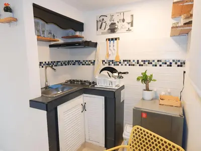 a small kitchen with a sink and a counter at Studio Nurita Boston in Barranquilla