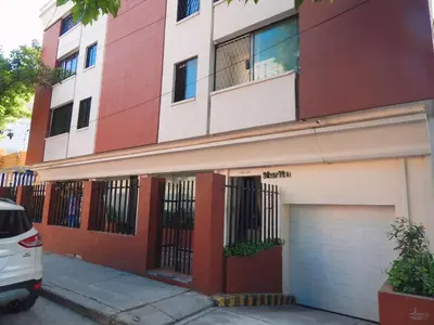 a white car parked in front of a building at Studio Nurita Boston in Barranquilla