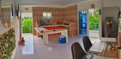 a kitchen with a pool table in the middle of a room at Apartamento sereno, cerca al mar in El Porvenir