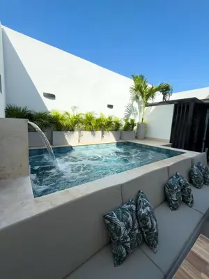a hot tub on a balcony with plants at Casa Gracia Hotel Boutique in Cartagena de Indias