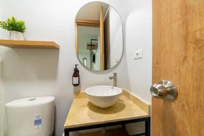 a bathroom with a sink and a mirror at Casa Gracia Hotel Boutique in Cartagena de Indias