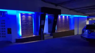 a room with blue lights in a parking lot at Los Prados Vip in Barranquilla