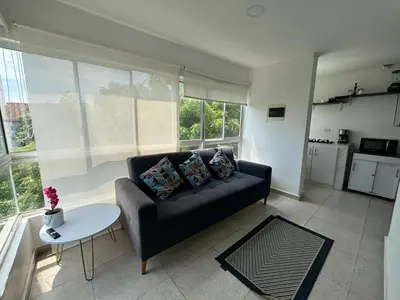 a living room with a couch and a table at Apartamento 2 habitaciones Paraiso, by Accommdo360 in Barranquilla