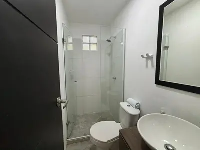 a bathroom with a shower and a toilet and a sink at Apartamento 2 habitaciones Paraiso, by Accommdo360 in Barranquilla