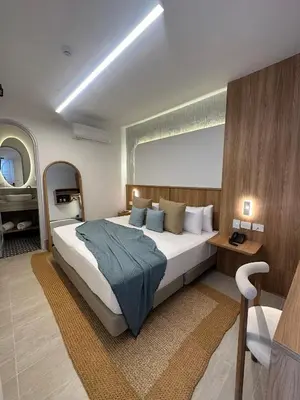 a bedroom with a large bed in a room at Casa Bugó Arsenal Hotel Boutique en Getsemaní in Cartagena de Indias