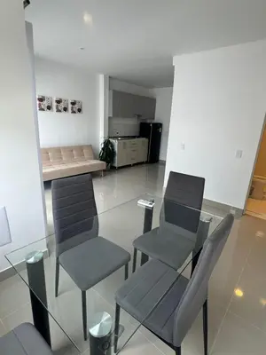 a living room with two chairs and a couch at Apartamentos Cartagena Acuarium in Cartagena de Indias