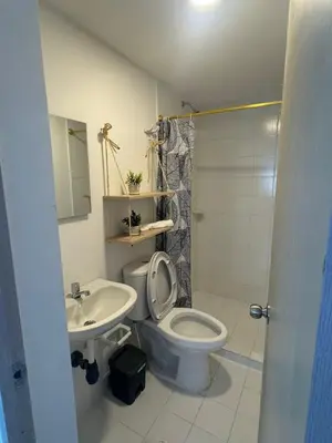 a bathroom with a toilet and a sink at Apartamentos Cartagena Acuarium in Cartagena de Indias