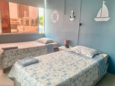 a room with two beds and a window at Apartamento Acogedor en Cartagena in Cartagena de Indias