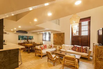 a living room with a couch and a table at Luxury Colonial Home at Virrey Eslava in Cartagena de Indias