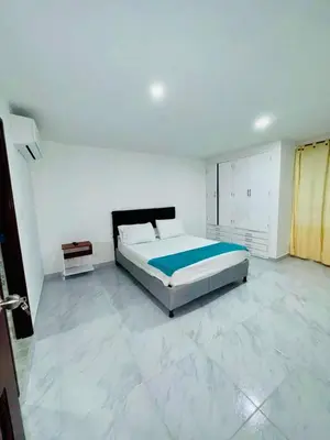 a bedroom with a large bed in a white room at Apartamento remodelado cómodo y cerca al mar in Cartagena de Indias