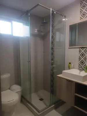 a bathroom with a shower and a toilet and a sink at apartamento Amazilia en alameda del rio in Barranquilla