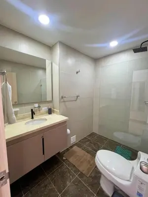 a bathroom with a sink and a toilet and a mirror at Cartagena Aparta Suite con Vista al Mar in Cartagena de Indias