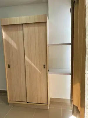 a closet with a wooden door in a room at Cartagena Aparta Suite con Vista al Mar in Cartagena de Indias