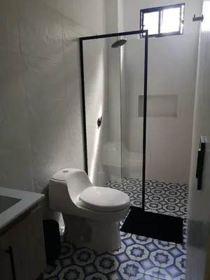 a bathroom with a toilet and a glass shower at Azul in Santa Marta