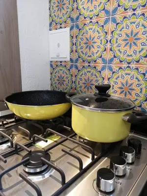 two pans sitting on top of a stove at Azul in Santa Marta