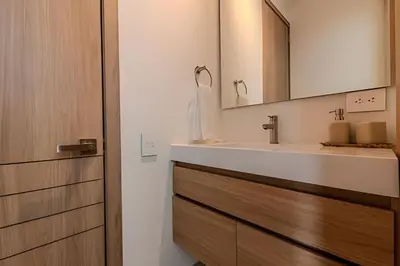 a bathroom with a sink and a mirror at Lujoso A Estrenar/Oasis Laguna Cristalina 2BR in Los Arrayanes