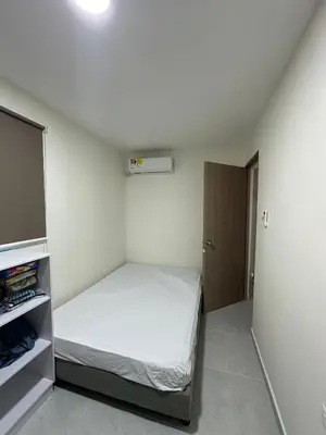 a small bedroom with a bed and a closet at Cabaña salgar - la casa de la playa in Puerto Salgar