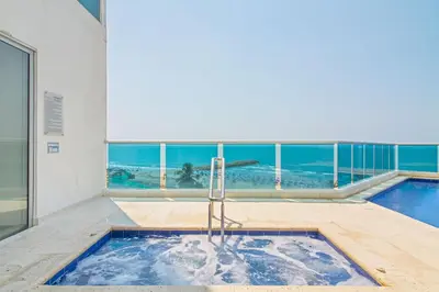 a swimming pool in a building with a view of the ocean at Vista de lujo al mar y la bahía in Cartagena de Indias