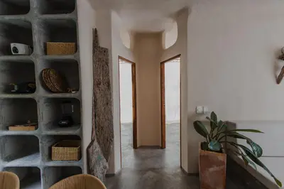 a living room with a stone wall at Apartamento Atlantic 211 in La Perdiz