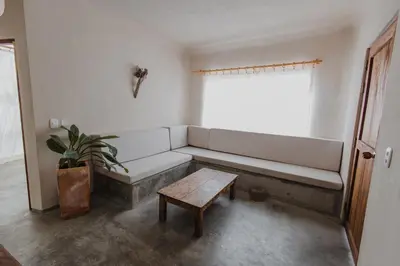 a room with a couch and a table and a window at Apartamento Atlantic 211 in La Perdiz