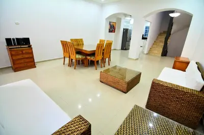a dining room with a table and chairs at Te la mereces, frente al mar in Cartagena de Indias
