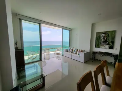 a living room with a view of the ocean at Apartamentos Mi Reserva OK - Bahía Marina in Coveñas