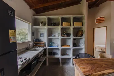 a kitchen with a counter and a sink and a stove at Apartamento Atlantic 311 in La Perdiz
