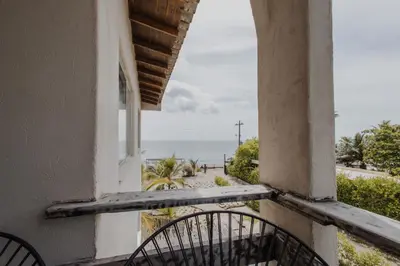 a window of a building with a view of the ocean at Apartamento Atlantic 311 in La Perdiz