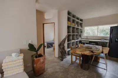 a living room with a table and a mirror at Apartamento Atlantic 212 in La Perdiz