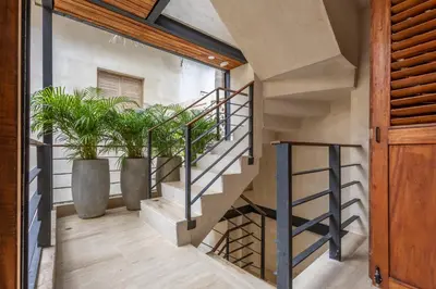 a staircase in a house with potted plants at Casa Fernandez By SoHo in Cartagena de Indias