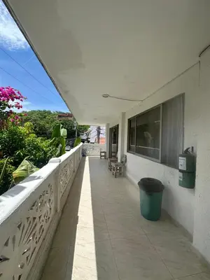 a balcony of a white building with a trash can at Casona La Española in Cartagena de Indias