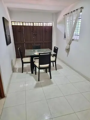 a dining room with a table and chairs at Hostal tercer cielo Restaurante Fidelio in Santa Marta