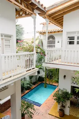 a house with a swimming pool and a balcony at Casa Guerrero in Cartagena de Indias