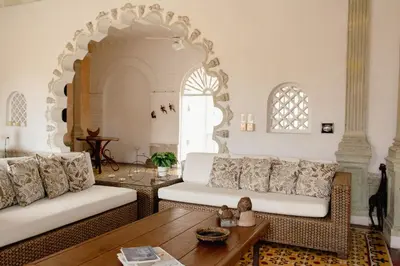 a living room with two white couches and a table at Casa Guerrero in Cartagena de Indias
