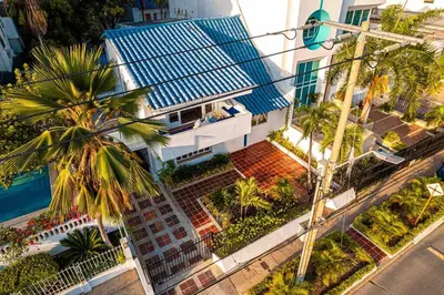 an overhead view of a building with a palm tree at Luxury Bryon Pool in Cartagena de Indias