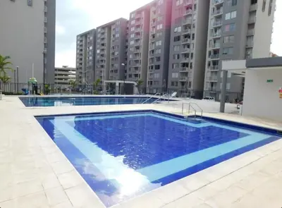 a large swimming pool in front of some buildings at Apartamento en alameda del Río in Barranquilla