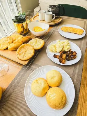 a table with plates of food on top at Tropical Oasis Barranquilla in Barranquilla