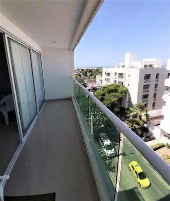 a balcony of a building with a yellow car at Appartamento Italian Style in Cartagena de Indias