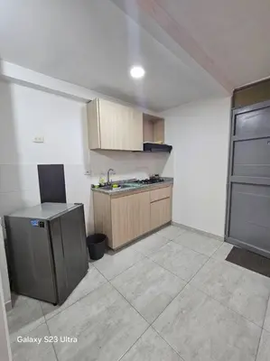 a kitchen with a sink and a counter in a room at Hermoso apartamento familiar! exento de IVA in Barranquilla