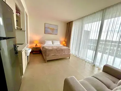 a hotel room with a bed and a large window at Exclusive Loft In Cartagena By Huepedia in Cartagena de Indias