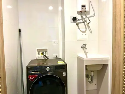 a bathroom with a washing machine and a sink at Exclusive Loft In Cartagena By Huepedia in Cartagena de Indias