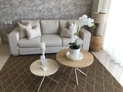 a living room with a white couch and two tables at New Apartment 2BR In Morros ECO in Bolivar