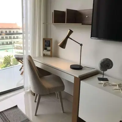 a desk with a lamp and a chair in a room at New Apartment 2BR In Morros ECO in Bolivar