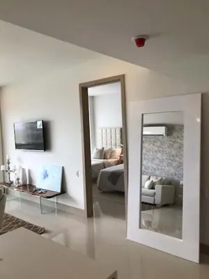 a living room with a mirror and a couch at New Apartment 2BR In Morros ECO in Bolivar